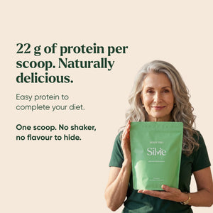 Woman in her 60s holding a Silvie Body Pro pouch: 22 g of protein per scoop, no shaker needed