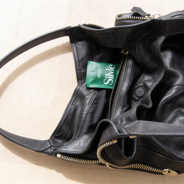 Silvie supplement sachet inside a woman's purse. 