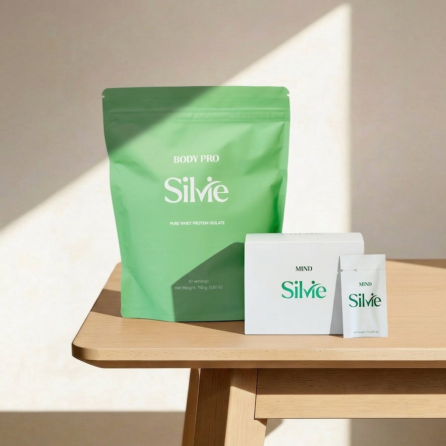 Silvie protein powder package, supplement packaging and box on a wooden table.